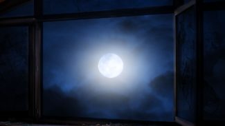 View of the moon through a window