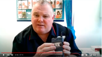 Colin Beevor holding a TENS machine