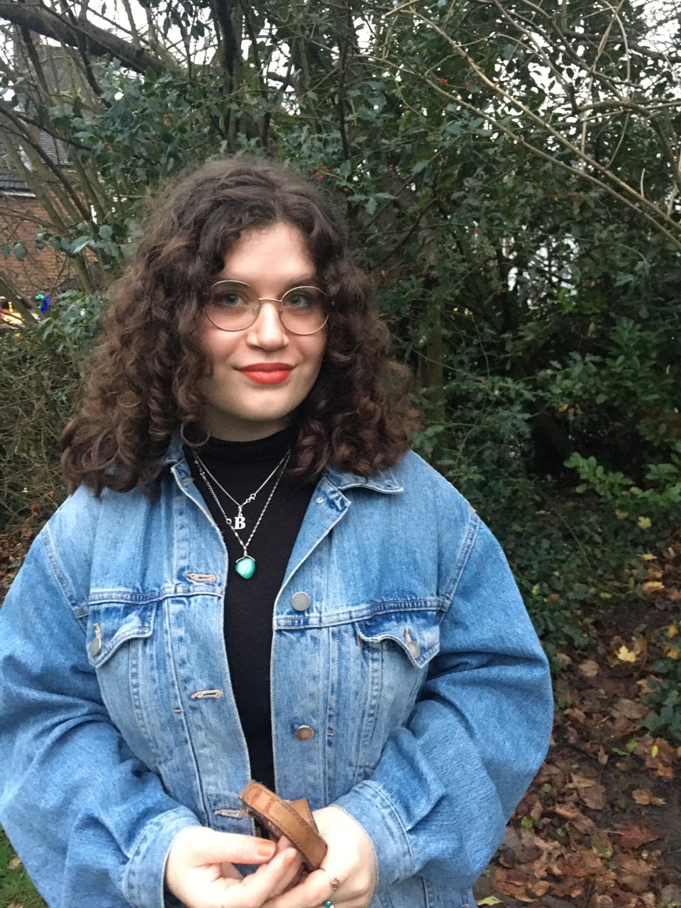 Bethany standing in front of a tree