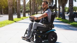 Man in mobility scooter taking a sunny selfie