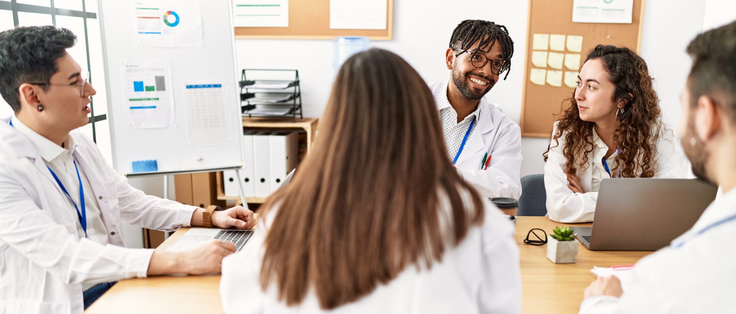 Group of young doctor people discussing in a medical meeting at the clinic office.